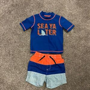 Boys size 3T swim shorts and rashguard
